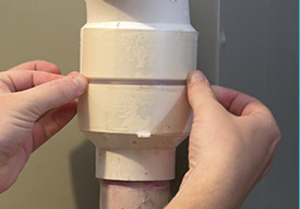 Adding adhesive to plumbing pipe